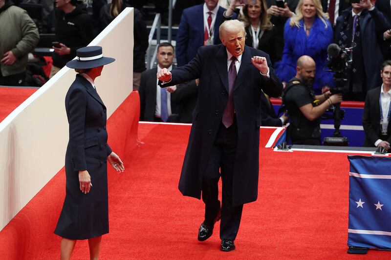 First lady Melania Trump and U.S. President Donald Trump arrive for an indoor inauguration parade at the Capital One Arena in Washington, DC.