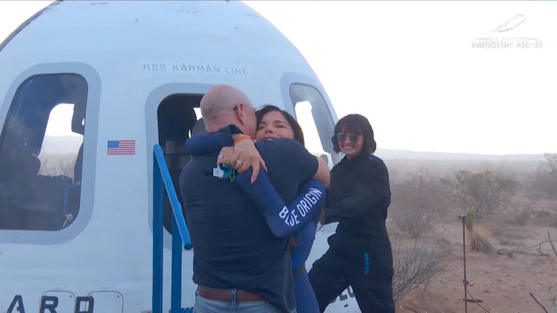 Jeff Bezos embraces Lauren Sanchez as she comes out of the capsule in which she, Pop star Katy Perry, journalist Gayle King, and other participants, landed back on earth after blasting off into space on a Blue Origin rocket, as part of the New Shepard Mission NS-31, marking the first all-female flight crew in more than six decades, in West Texas, Texas, U.S., April 14, 2025, in this screen grab taken from a video. Blue Origin/Handout via REUTERS    THIS IMAGE HAS BEEN SUPPLIED BY A THIRD PARTY. NO RESALES. NO ARCHIVES. MANDATORY CREDIT