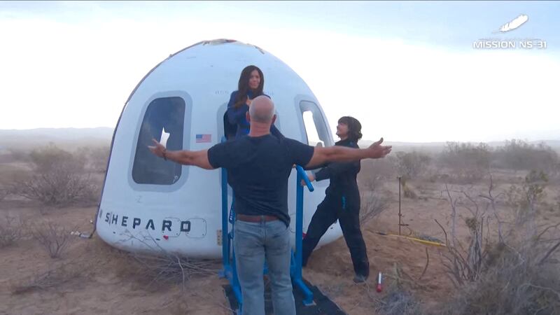 Jeff Bezos stands as Lauren Sanchez comes out of the capsule in which she, pop star Katy Perry, journalist Gayle King, and other participants, landed back on earth after blasting off into space on a Blue Origin rocket, as part of the New Shepard Mission NS-31, marking the first all-female flight crew in more than six decades, in West Texas, Texas, U.S., April 14, 2025, in this screen grab taken from a video. Blue Origin/Handout via REUTERS    THIS IMAGE HAS BEEN SUPPLIED BY A THIRD PARTY. NO RESALES. NO ARCHIVES. MANDATORY CREDIT     TPX IMAGES OF THE DAY