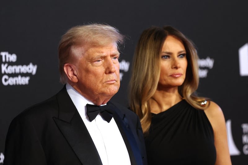 President Donald Trump (L) and First Lady Melania Trump arrive to attend the opening night of "Les Miserables" at the Kennedy Center in Washington, DC,