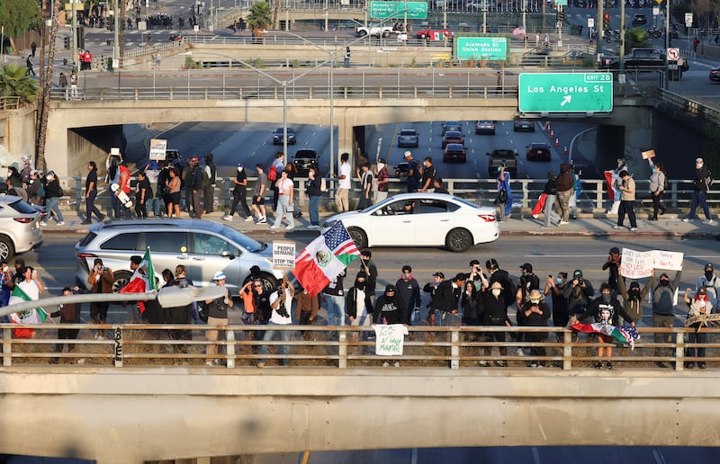 Demonstrators participate in a protest against federal immigration sweeps in downtown Los Angeles, California.