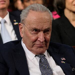 Senate Minority Leader Chuck Schumer (D-NY) listens as U.S. President Donald Trump addresses a joint session of Congress at the U.S. Capitol.