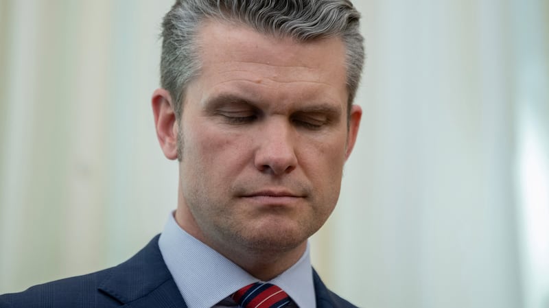 Defense Secretary Pete Hegseth closes his eyes.
