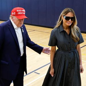 PALM BEACH, FLORIDA - NOVEMBER 05: Republican presidential nominee former President Donald Trump escorts his wife Melania Trump at the polling place in the Morton and Barbara Mandel Recreation Center on Election Day, on November 05, 2024 in Palm Beach, Florida.  Trump will hold an Election Night event at the Palm Beach Convention Center. (Photo by Chip Somodevilla/Getty Images)