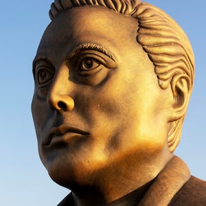 A statue of Elon Musk sits by the side of the road leading to his Space X facility, February 6, 2025 on the outskirts of Brownsville, Texas.