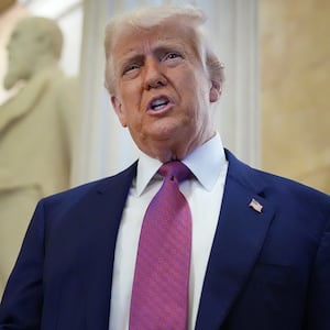 President Donald Trump arrives with Speaker of the House Mike Johnson for a House Republican meeting at the U.S. Capitol on May 20, 2025 as he pushes members to pass his massive bill.