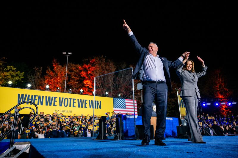 Democratic presidential nominee Kamala Harris and her running mate, Minnesota Gov. Tim Walz, greet supporters at the conclusion of a campaign rally on October 28, 2024 in Ann Arbor, Michigan.