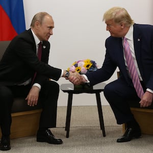 U.S. President Donald Trump greets Russian President Vladimir Putin during their bilateral meeting at the G20 Osaka Summit 2019, in Osaka, Japan.