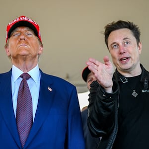 Elon Musk speaks with U.S. President-elect Donald Trump as they watch the launch of the sixth test flight of the SpaceX Starship rocket