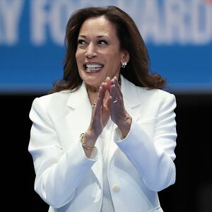 U.S. Vice President Kamala Harris greets the crowd as she arrives on stage at a campaign rally at the Enmarket Arena August 29, 2024 in Savannah, Georgia.