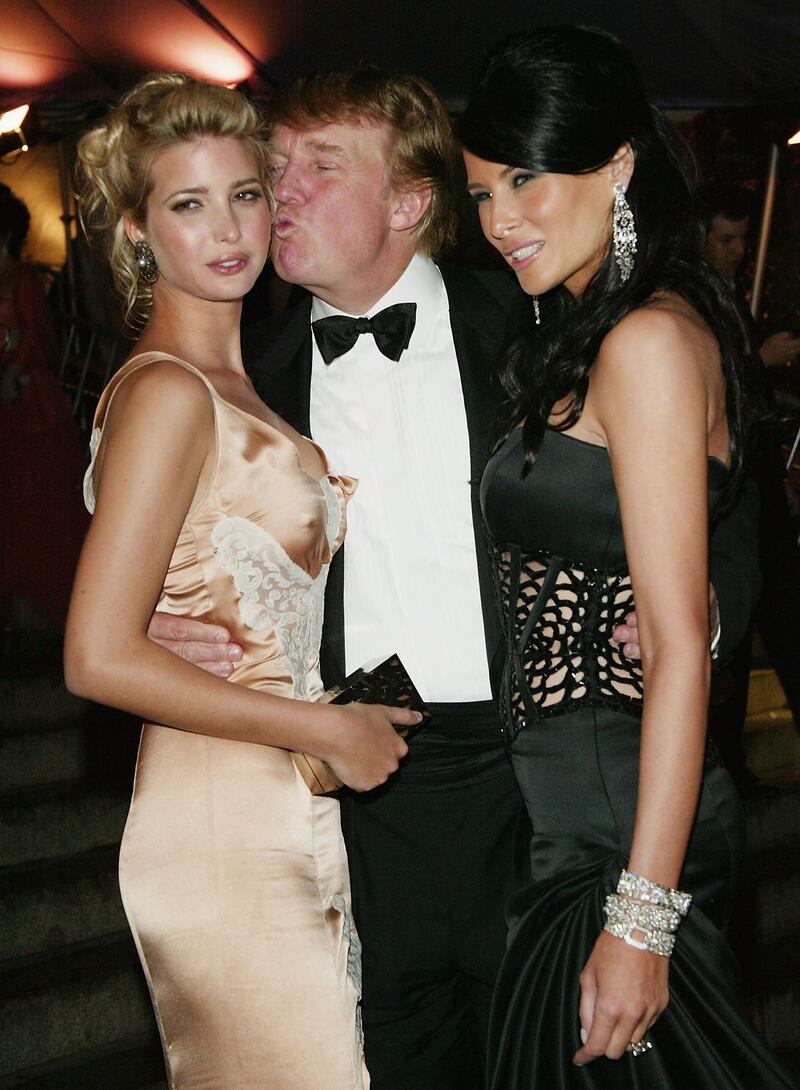 Donald Trump, Ivanka Trump, and then-Melania Knauss attend the "Dangerous Liaisons: Fashion and Furniture in the 18th Century" Costume Institute benefit gala on April 26, 2004 at the Metropolitan Museum of Art, in New York.