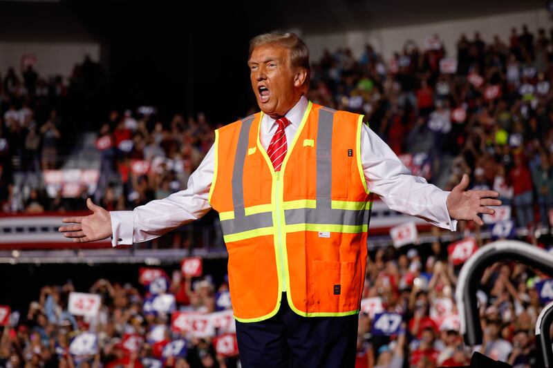 Trump wore a visibility vest to troll Biden.
