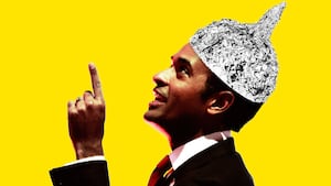 Photo illustration of Vivek Ramaswamy wearing a tinfoil hat on a yellow background