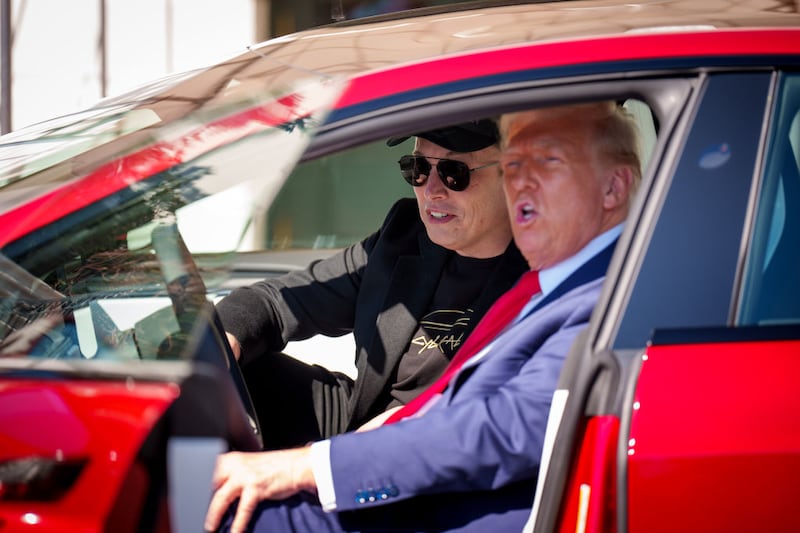 President Donald Trump and White House Senior Advisor, Tesla and SpaceX CEO Elon Musk sit in a Tesla Model S on the South Lawn of the White House on March 11, 2025 in Washington, DC.