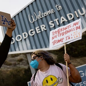 Group of demonstrators protests outside the entrance of Dodger Stadium.