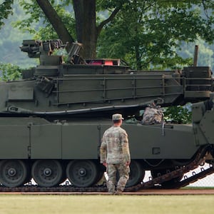 An Army soldier walks near a tank at West Potomac Park in preparation for the Army's 250th Anniversary Parade on June 12, 2025 in Washington, DC, but many Republican lawmakers are not sticking around for the festivities taking place on President Trump's birthday.