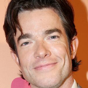 John Mulaney smiles