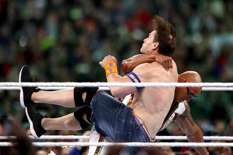 PHILADELPHIA, PENNSYLVANIA - APRIL 07: Dwayne "The Rock" Johnson and John Cena fight during Night Two at Lincoln Financial Field on April 07, 2024 in Philadelphia, Pennsylvania.  (Photo by Tim Nwachukwu/Getty Images)