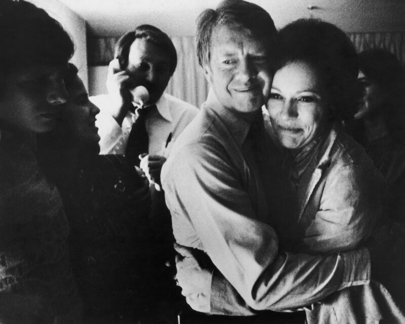 Democratic presidential candidate Jimmy Carter embraces his wife Rosalynn after receiving the final news of his victory in the 1976 presidential election.