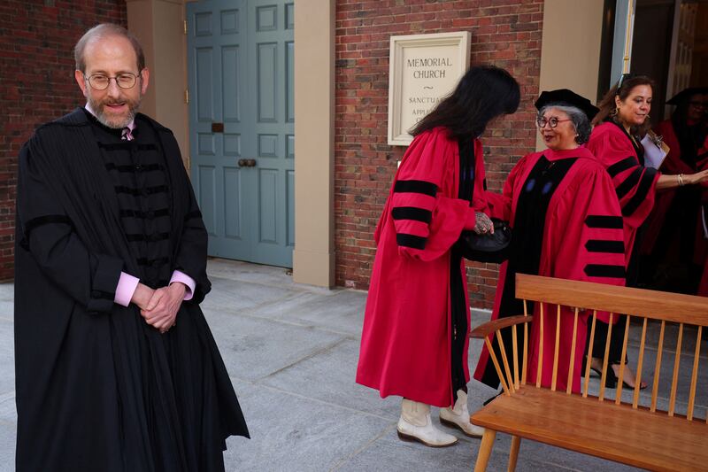 Interim president Alan Garber waits for the the honorary degree recipients to assemble for a group photograph before the 373rd Commencement Exercises at Harvard University in Cambridge, Massachusetts, U.S., May 23, 2024.  REUTERS/Brian Snyder