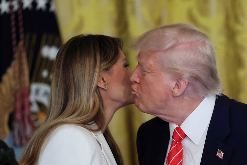 U.S. President Donald Trump kisses first lady Melania Trump.