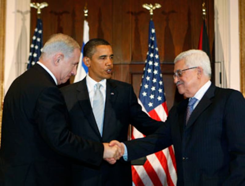 articles/2013/06/25/working-with-bibi/netanyahu-and-abbas-handshake_rru9ep