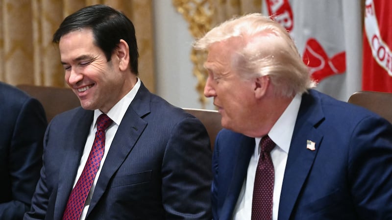 Secretary of State Marco Rubio and President Donald Trump participate in a Cabinet meeting.