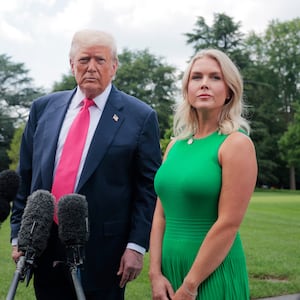 President Donald Trump, joined by White House Press Secretary Karoline Leavitt, speaks to the media as he departs the White House on July 15, 2025 in Washington, DC.