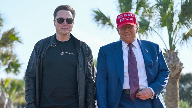U.S. President-elect Donald Trump greets Elon Musk as he arrives to attend a viewing of the launch of the sixth test flight of the SpaceX Starship rocket on November 19, 2024 in Brownsville, Texas.