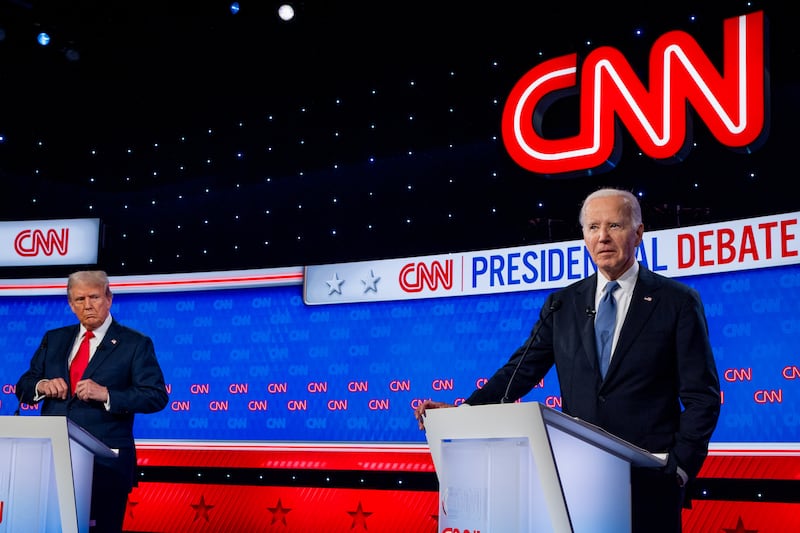 Republican presidential candidate, former President Donald Trump (L) looks at U.S. President Joe Biden during the CNN Presidential Debate at the CNN Studios on June 27, 2024 in Atlanta, Georgia. The debate is the first of two scheduled between the two candidates before the November election.