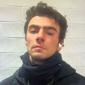 Luigi Mangione perp walk and mugshot.