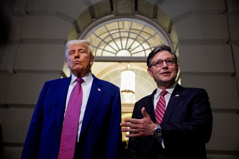 Speaker Mike Johnson speaking to reporters with President Donald Trump as they depart a House Republican meeting on May 20, 2025.
