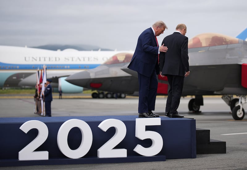 President Vladimir Putin walk together at Joint Base Elmendorf-Richardson on August 15, 2025 in Anchorage, Alaska ahead of their high-stakes sit-down.