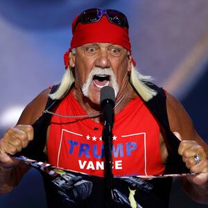 Professional wrestler Hulk Hogan rips his shirt as he speaks on stage on the fourth day of the Republican National Convention in Milwaukee.