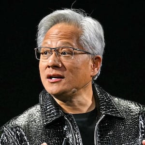 TOPSHOT - Nvidia CEO Jensen Huang delivers a keynote address at the Consumer Electronics Show (CES) in Las Vegas, Nevada on January 6, 2025. Gadgets, robots and vehicles imbued with artificial intelligence will once again vie for attention at the Consumer Electronics Show, as vendors behind the scenes will seek ways to deal with tariffs threatened by US President-elect Donald Trump. The annual Consumer Electronics Show (CES) opens formally in Las Vegas on January 7, 2025, but preceding days are packed with product announcements. (Photo by Patrick T. Fallon / AFP) (Photo by PATRICK T. FALLON/AFP via Getty Images)