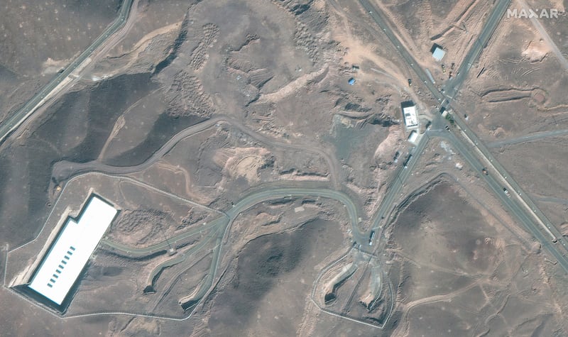 A satellite image shows trucks and bulldozers near the entrance to the Fordow nuclear facility, near Qom, Iran June 20, 2025.