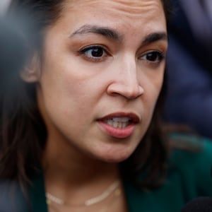 Alexandria Ocasio-Cortez speaks to reporters as she arrives for a vote series at the U.S. Capitol on September 25, 2024.