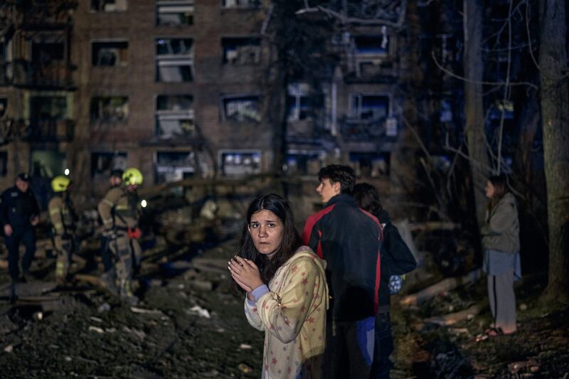 KYIV, UKRAINE - APRIL 24: Rescuers and civilians worked to pull victims from the rubble of a missile strike on a residential building resulting in two deaths and 54 injured on April 24, 2025 in Kyiv, Ukraine. Among the injured were six children and one pregnant woman (Photo by Kostiantyn Liberov/Libkos/Getty Images)