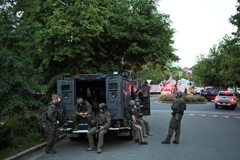 Policemen gather near the scene of an attack that injured multiple people, in Boulder, Colorado.