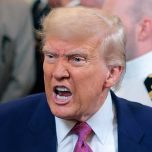 President Donald Trump responds to a reporters question at the White House.