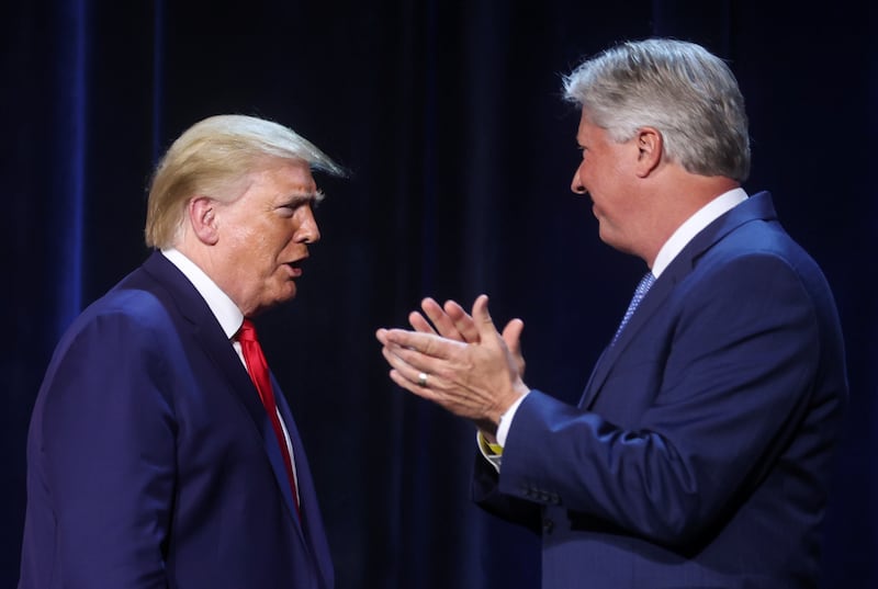 U.S. President Donald Trump is greeted by Pastor Robert Morris at a roundtable discussion at Gateway Church.