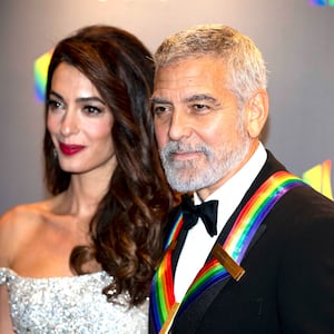 Amal Clooney and honoree George Clooney arrive on the red carpet of the 2022 Kennedy Center honors in Washington, D.C. on December 4, 2022.