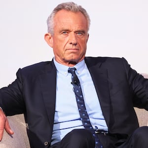 Robert F. Kennedy Jr. listens as he is introduced by Rabbi Shmuley Boteach during the World Values Network's Presidential candidate series at the Glasshouse on July 25, 2023 in New York City.