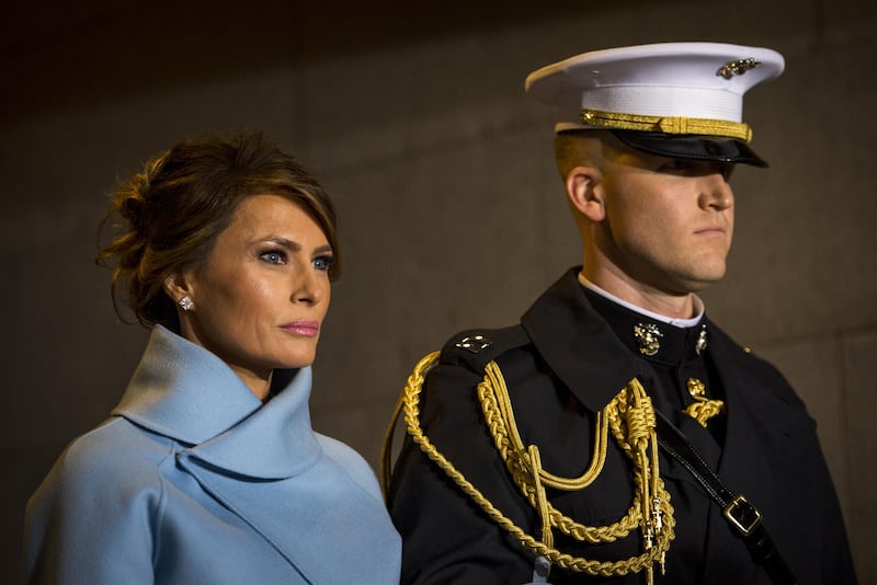 Melania Trump, escorted by a U.S. Marine, walks toward the platform the 58th Presidential Inauguration in Washington, D.C., Jan. 20, 2017.