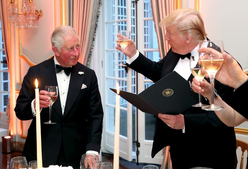 LONDON, ENGLAND - JUNE 04: US President Donald Trump (R) and First Lady Melania Trump host a dinner at Winfield House for Prince Charles, Prince of Wales (L) and Camilla, Duchess of Cornwall, during their state visit on June 04, 2019 in London, England.