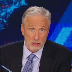 Jon Stewart roasting Elon Musk's cheese hat