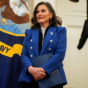 Michigan Governor Gretchen Whitmer stands, as U.S. President Donald Trump (not pictured) signs executive orders and proclamations, in the Oval Office at the White House in Washington, D.C., U.S., April 9, 2025. REUTERS/Nathan Howard