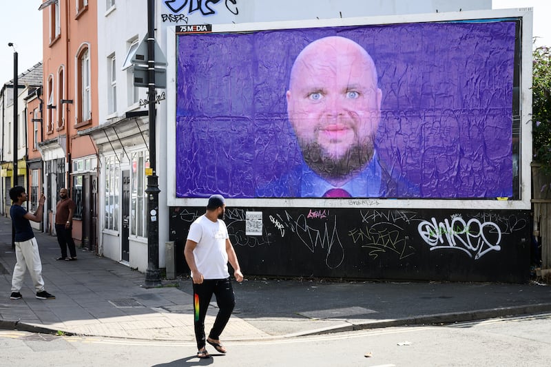 CHELTENHAM, OXFORDSHIRE - AUGUST 12: A poster by the "EveryoneHatesElon" protest group depicting a satirical image of US Vice-President JD Vance is displayed after being unofficially installed on a billboard on August 12, 2025 in Cheltenham, Oxfordshire.  Following US President Donald Trump's recent holiday in Scotland, Vice President JD Vance and his family are spending their summer vacation in Chipping Norton in the Cotswolds. The idyllic, rural village is home to the former British Prime Minister David Cameron. Locals have been unprepared for the level of security disruption as roads are closed around the Vances' 6-acre country estate, and elderly people have been stopped from walking in the countryside by police. (Photo by Leon Neal/Getty Images)