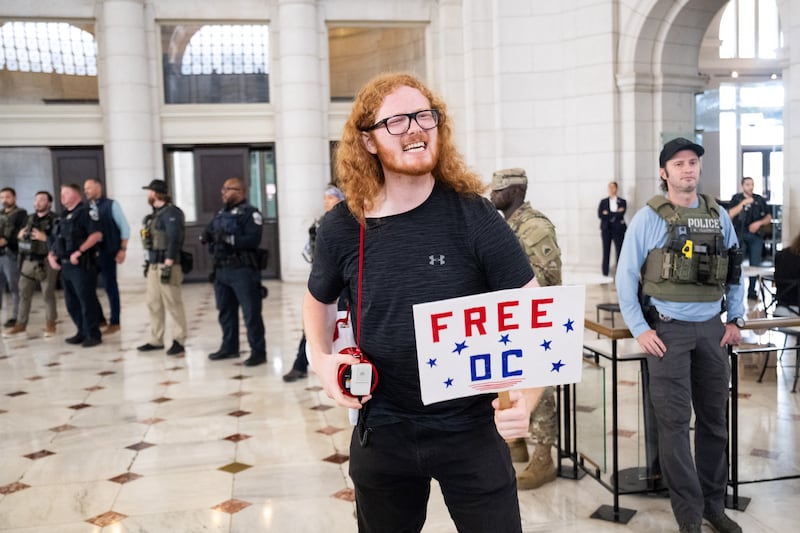 One of the protesters who shouted as law enforcement officials stood guard outside of Shake Shack while Vice President JD Vance, Defense Secretary Pete Hegseth and White House Deputy Chief of Staff Stephen Miller were gathered inside on August 20, 2025. Miller claimed the protesters were 90-year-olds.