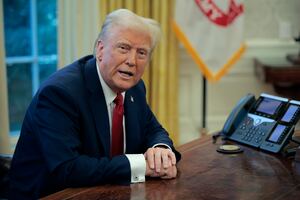U.S. President Donald Trump talks to reporters from the Resolute Desk after signing an executive order to appoint the deputy administrator of the Federal Aviation Administration in the Oval Office at the White House on January 30, 2025 in Washington, DC.